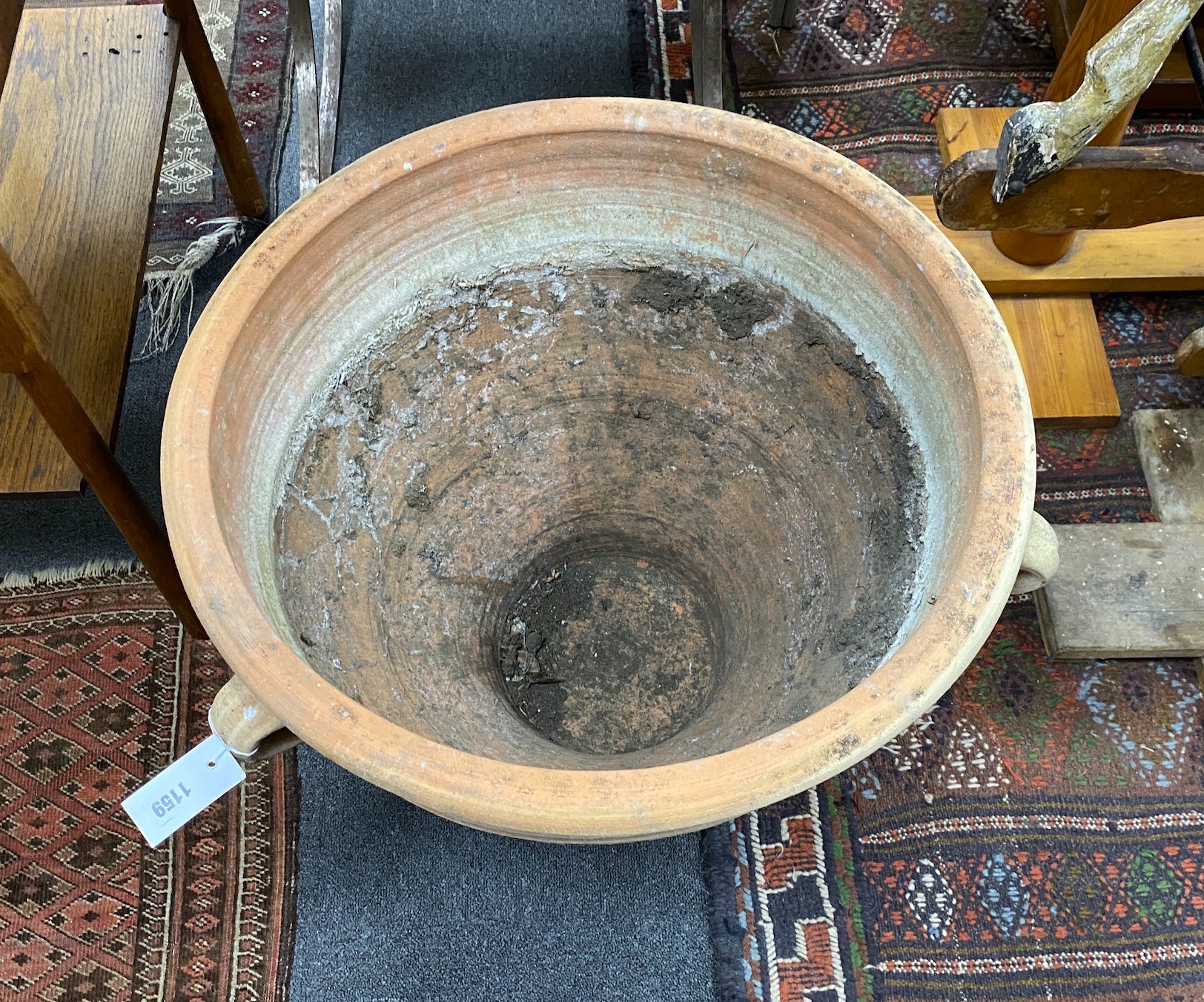 A Grecian style circular earthenware garden urn, diameter 62cm, height 50cm